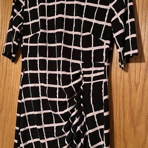 Black/pink, knee length, short sleeve dress. Machine washable. Like new!